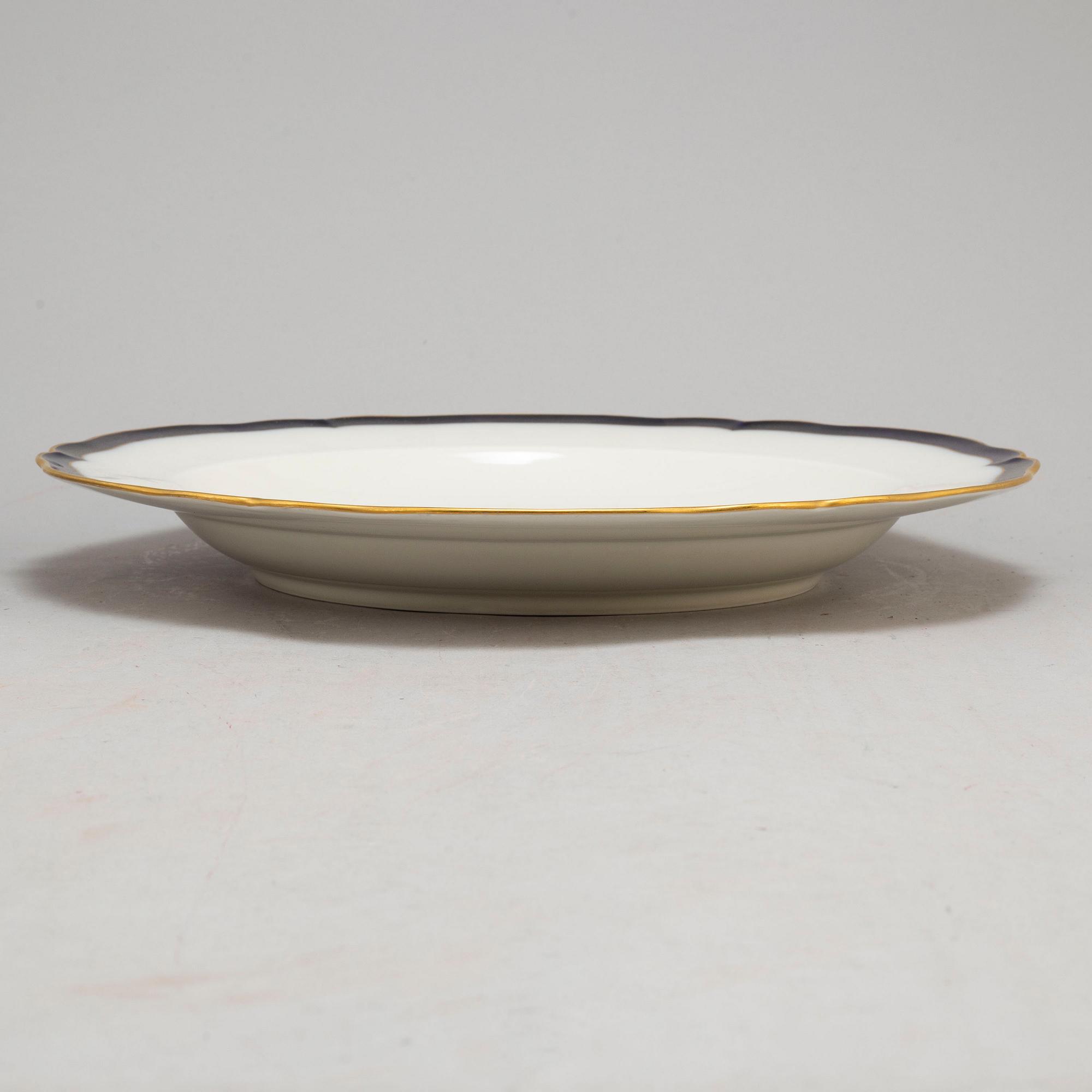 A set of three odd Berlin serving dishes, a set of two bowls and a dish and a figurine, 19th and 20th Century.