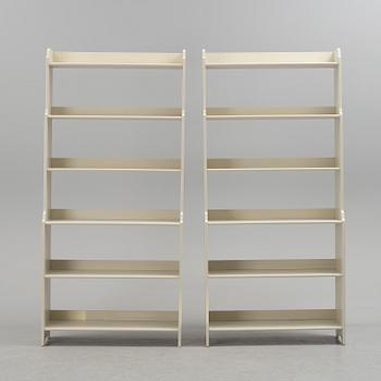 A pair of IKEA "Leksvik" painted bookcases.