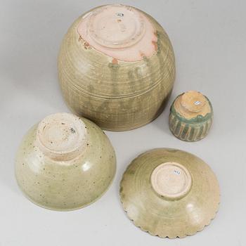 A group of olive green glazed bowls, South East Asia, 20th Century. (6 pieces).