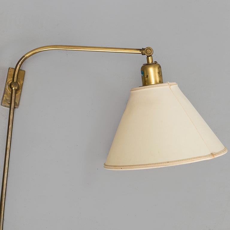 A pair of brass wall lamps by Josef Frank for Firma Svenskt Tenn.