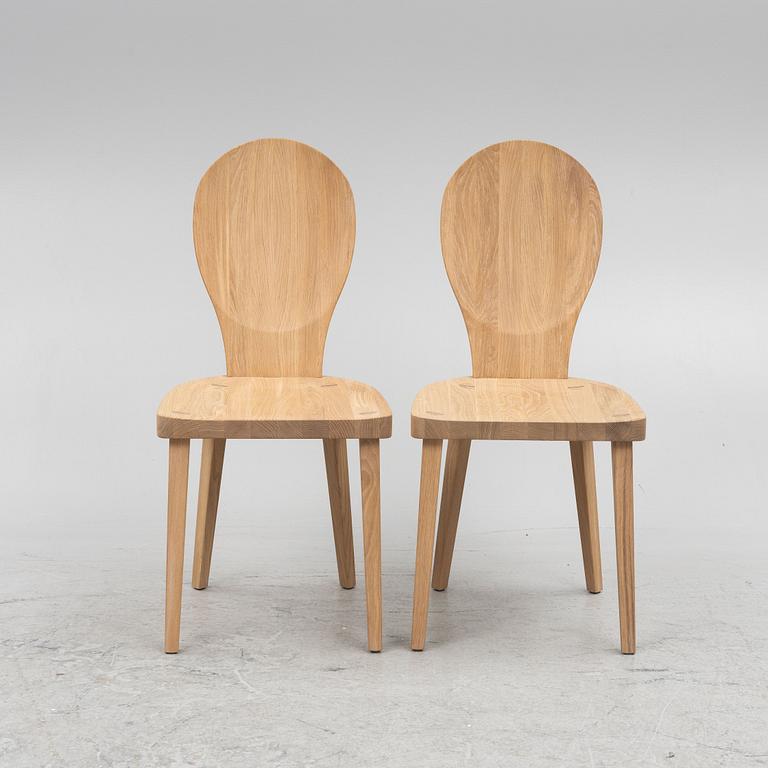 Carl Malmsten, a pair of "Skedblad" chairs, Tre Sekel, Sweden, 21st century.