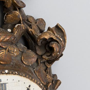 A 18th century wall clock.