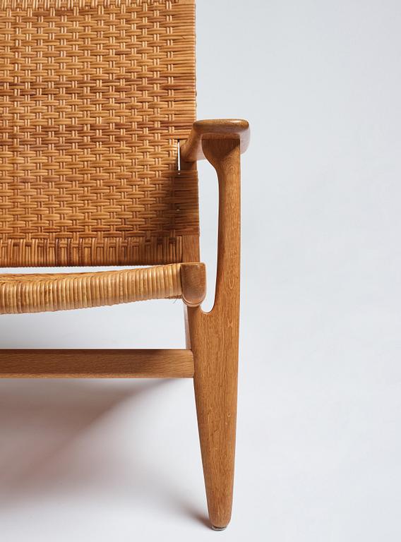 Hans J. Wegner, a pair of oak and rattan 'CH-27' chairs, Carl Hansen & Son, Denmark.