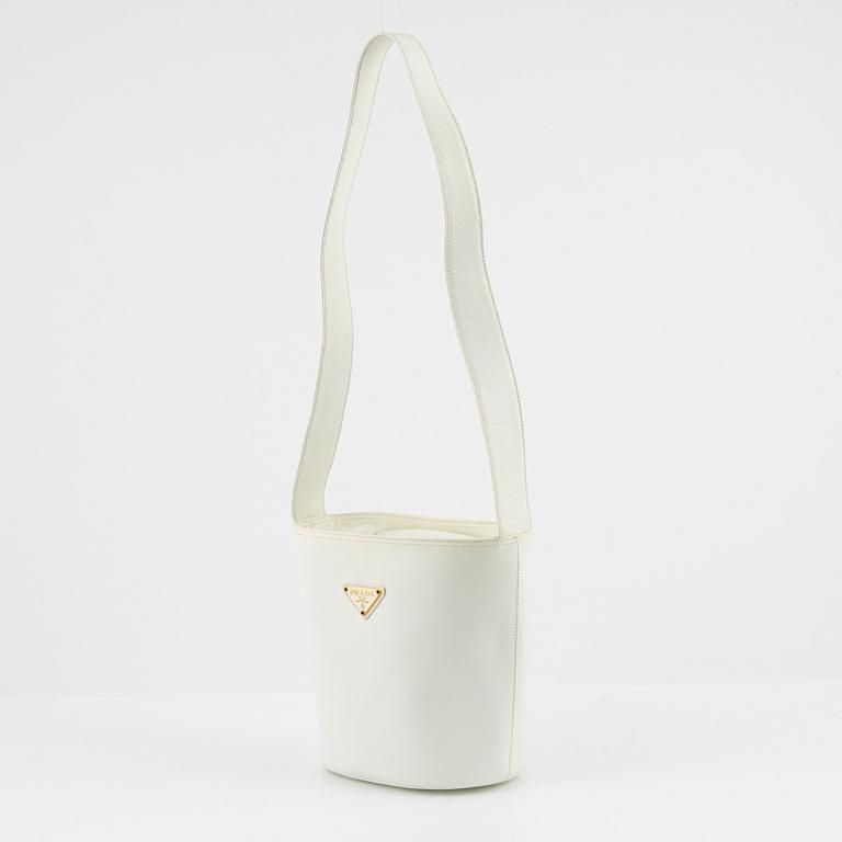 Prada, a white saffiano leather bag.