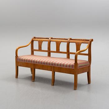 A first half of teh 19th century birch sofa.