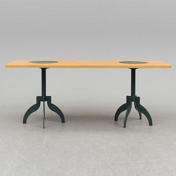 A "Triptyk" dining table by Jonas Bohlin for Källemo.