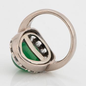 A jade and round brilliant-cut diamonds with a total weight of circa 0.60 ct.