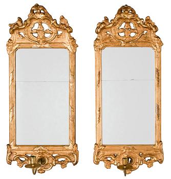 570. A pair of Swedish Rococo one-light girandole mirrors by N. Meunier.