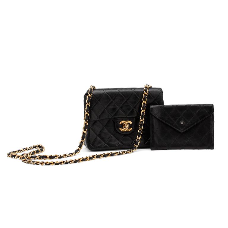 CHANEL, a black quilted leather "Mini flap" bag and wallet.