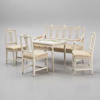 A sofa, three chairs and a table, Gustaivan style and of the Gustavian period, 19th-20th century.