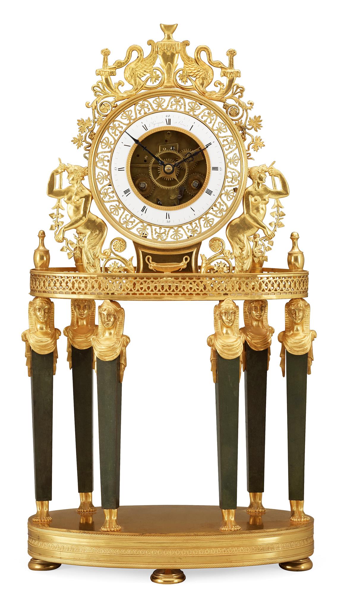 A French Empire gilt bronze mantel clock by L Grognot.