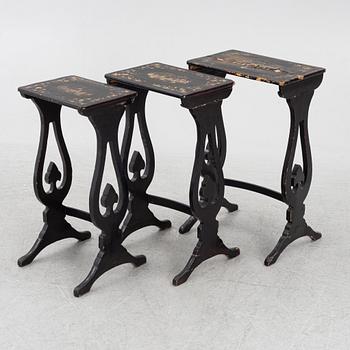 A lacquered nesting table, around 1900.