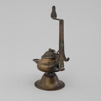 An 18th century bronze oil lamp.