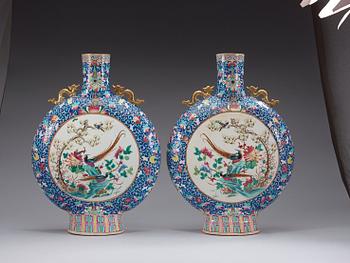 A pair of large famille rose moon flasks, Qing dynasty, 19th Century.