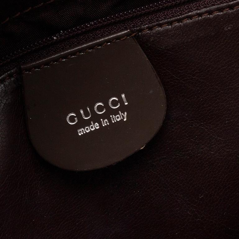 GUCCI, a double G leather bag.