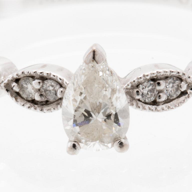 Ring in 18K white gold set with a pear-shaped diamond and round brilliant-cut diamonds, Van Bruun.