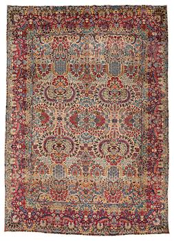 265. A carpet, a semi-antique Kerman, ca 375-379,5 x 268-271 cm.