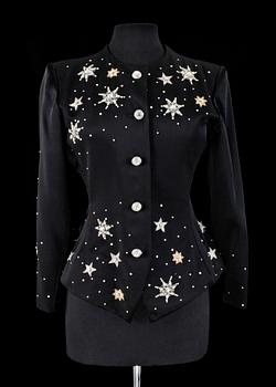 A black evening jacket by Yves Saint Laurent.