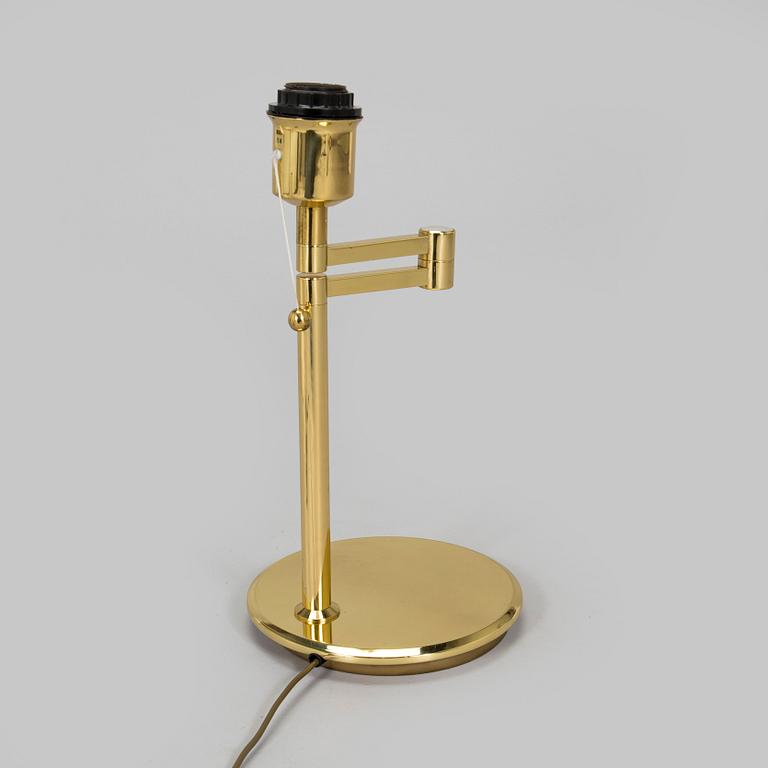 A 1970s/80s brass floor lamp, wall lamp and table lamp.