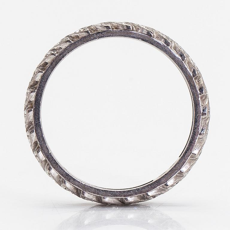 An 18K white gold eternity ring with octagon-cut diamonds totalling approx. 0.52 ct. Torbjörn Tillander, Helsinki 1992.