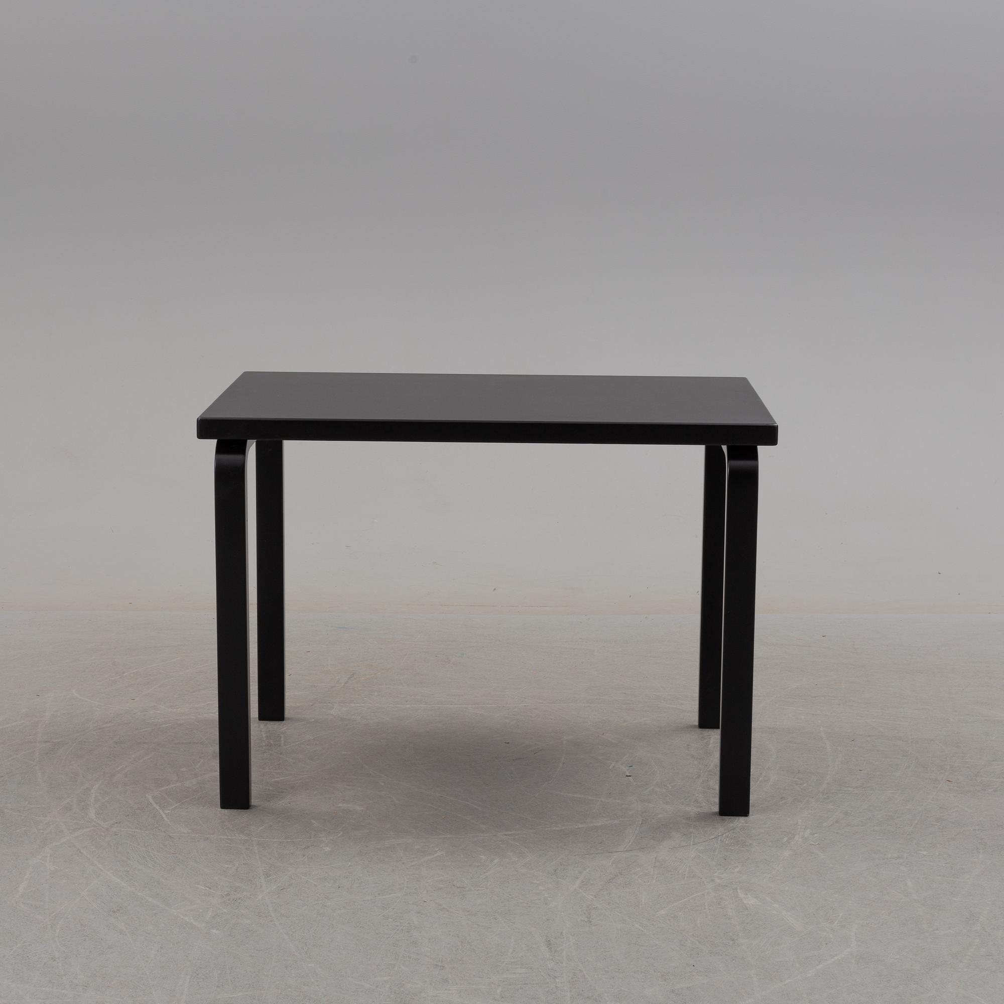 a dining table '81B' and four '66' chairs by Alvar Aalto, Artek.