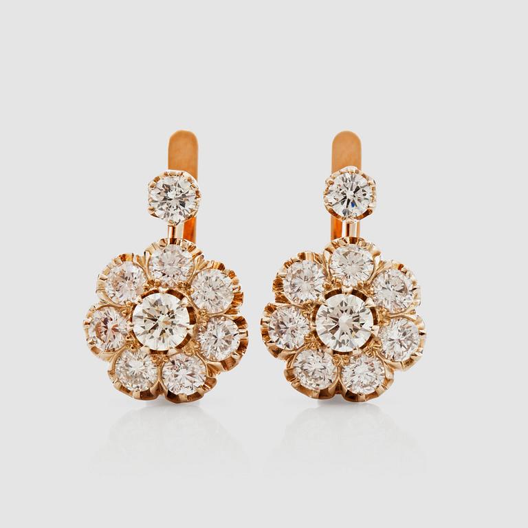 A pair of brilliant-cut diamond earrings. Total carat weight circa 3.18 cts in a Russian setting.