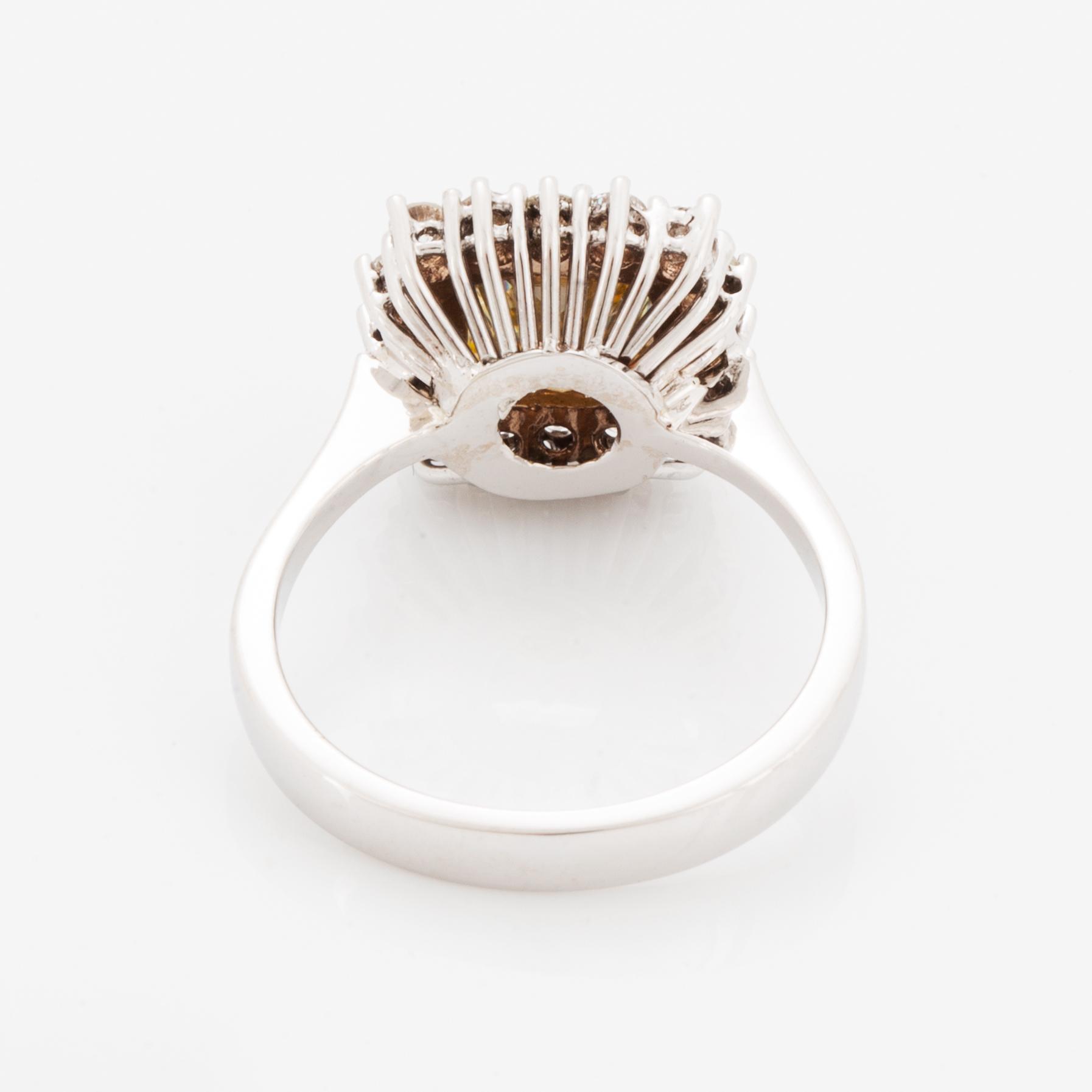 Princess-cut colour treated fancy deep brown-yellow diamond ring.