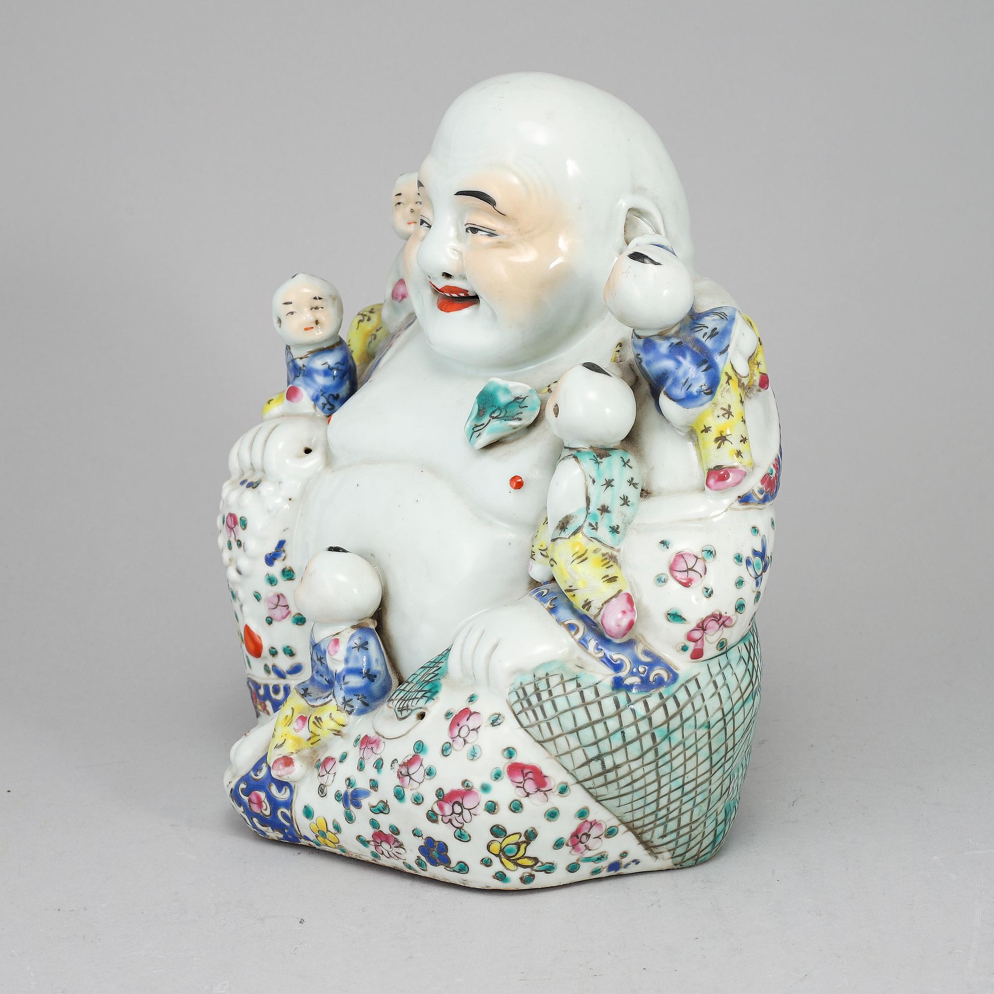 A large famille rose porcelain figure of a buddha with children, 20th century.