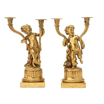 A pair of Louis XVI-style 19th century gilt bronze two-light candelabra.