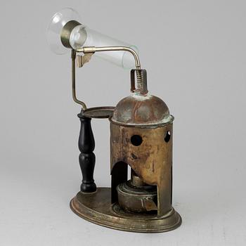 A tinplate burner, 20th century.