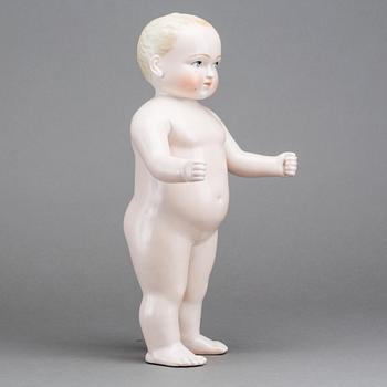 A PORCELAIN "FROZEN CHARLIE" DOLL, from around 1900.