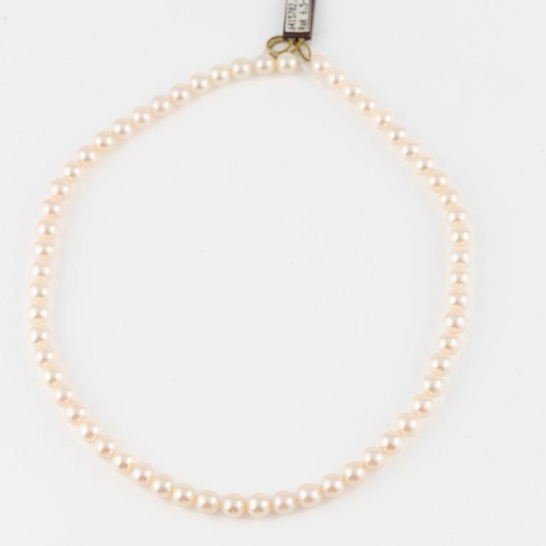 Three strands of cultured pearls, without clasps.