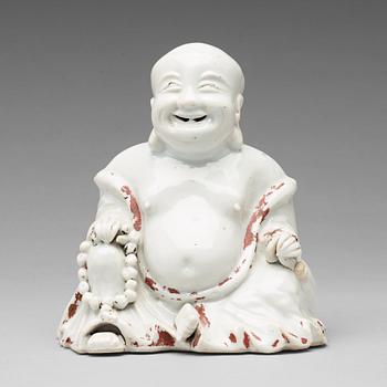 595. A blanc de chine figure of Buddai, Qing dynasty, 18th Century.