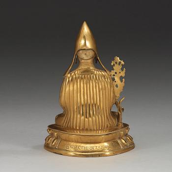 A gilt bronze figure of Seventh Dalai Lama, Lobzang Kalzang Gyatso, Qing dynasty (1644-1912).