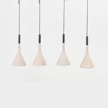 A set of four Aplomb mini" concrete ceiling pendants from Lucidi & Pever.