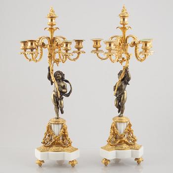 A pair of bronze and marble candelabra, possibly France, late 19th century.