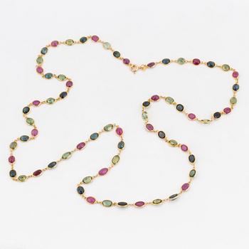 A necklace set with oval, mixed-cut, multi-coloured gemstones.