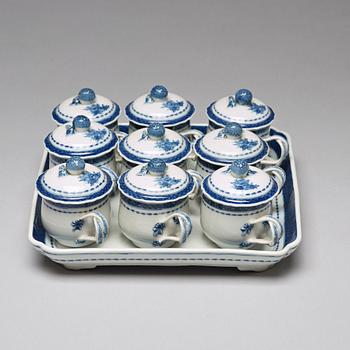 A set of nine blue and white custard cups with covers and a tray, Qing dynasty, Jiaqing (1796-1820).