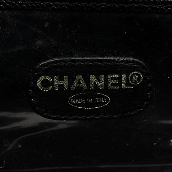 CHANEL, a black caviar leather beauty case.