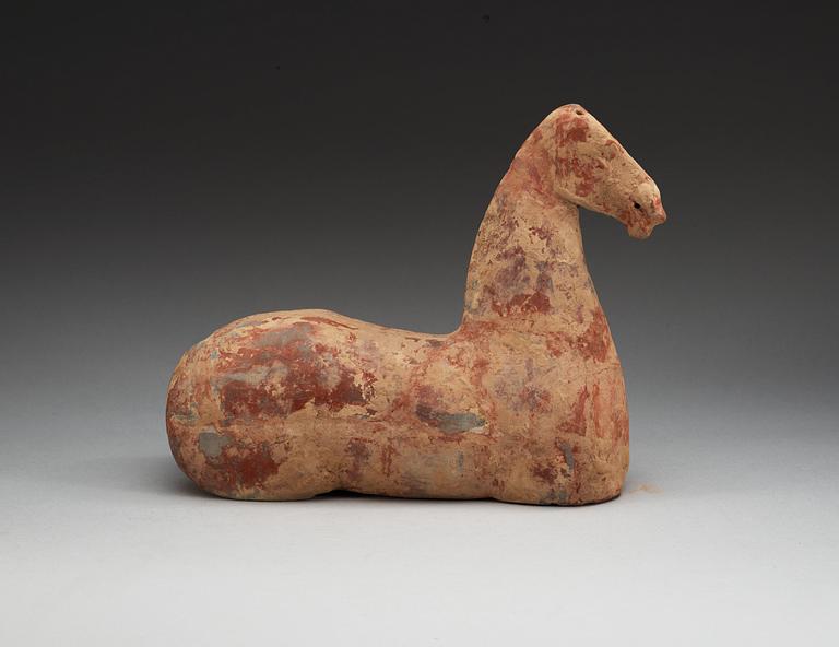 A pottery figure of a horse, Han dynasty (206 BC - 220 AD).