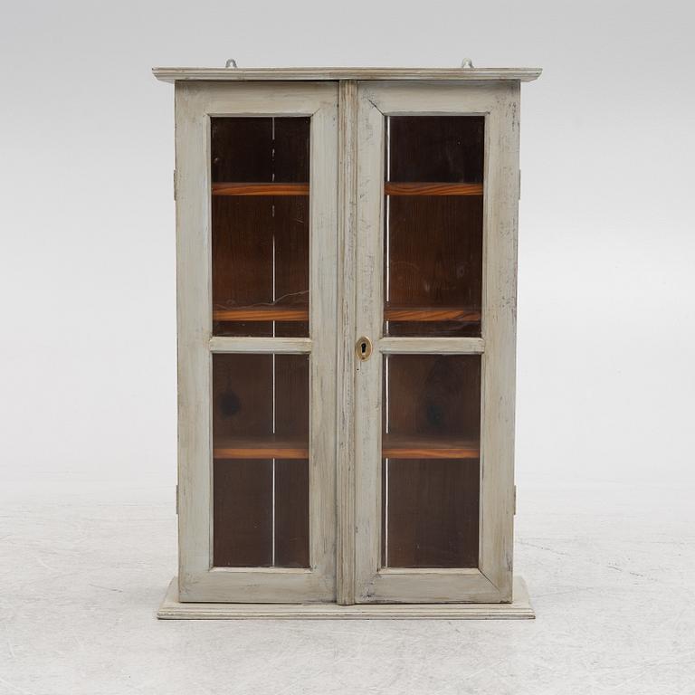 A wall cabinet, around 1900.