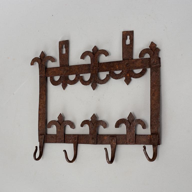 An 18th century iron wall hanger.