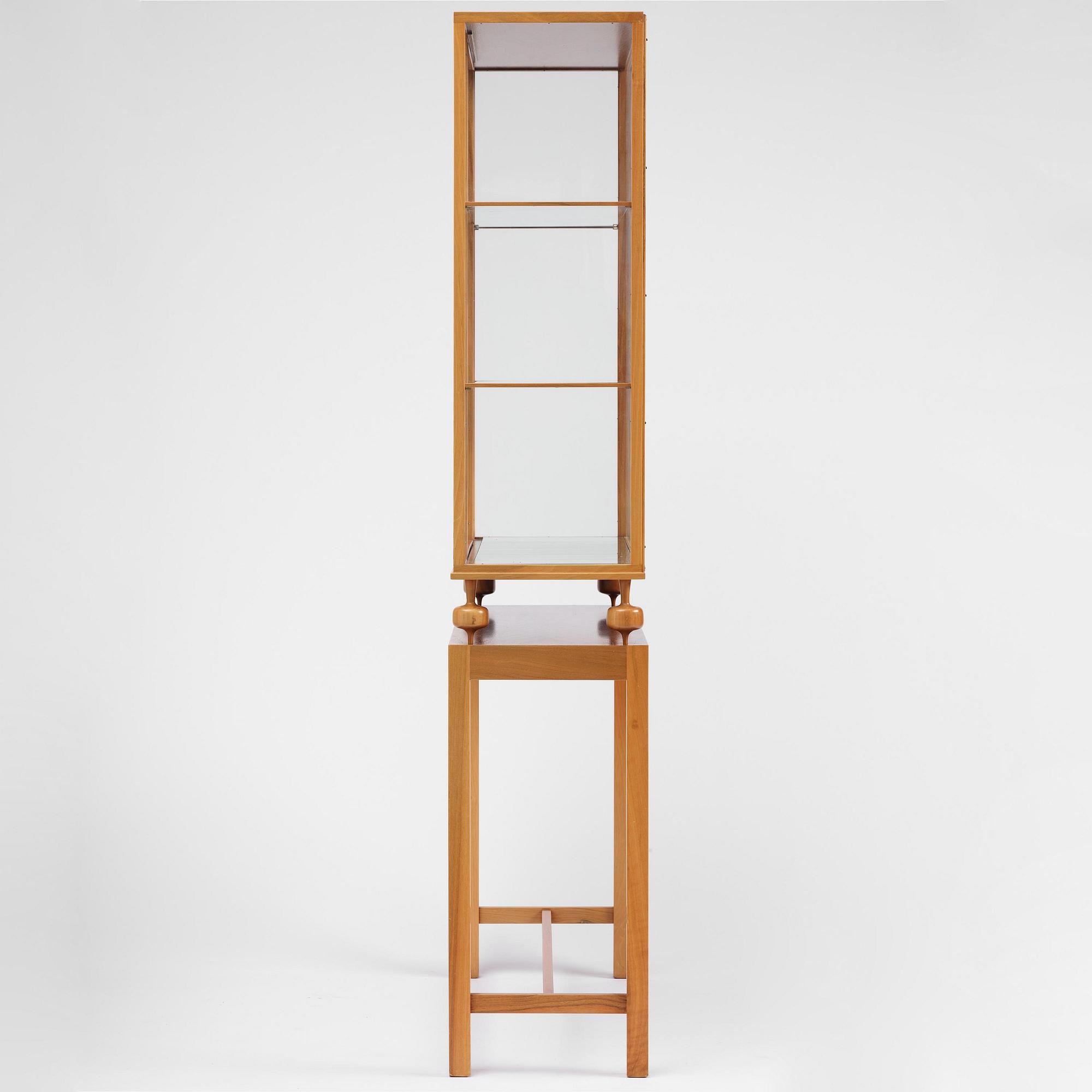 Josef Frank, a walnut showcase cabinet model "B 2077", Firma Svenskt Tenn.