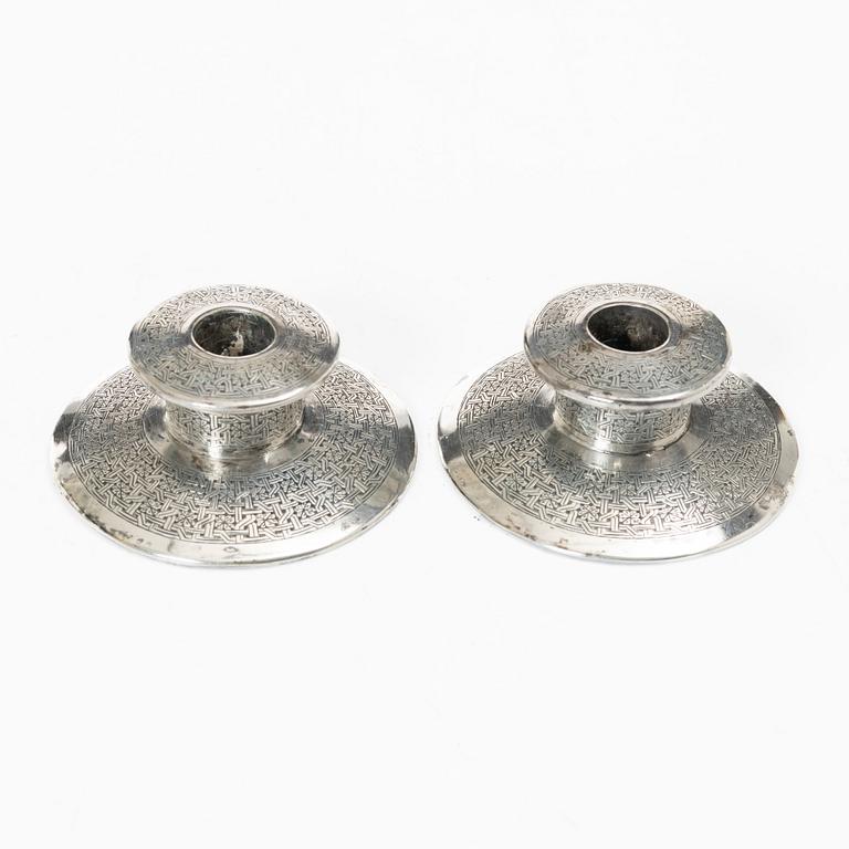 Two pairs of Persian silver candle holders, 20th century.