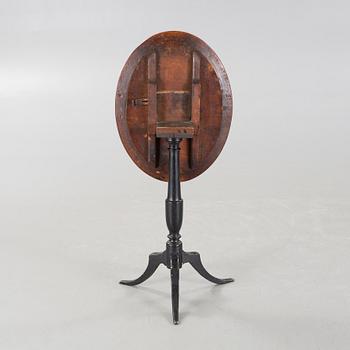 A 19th century drop-leaf table.