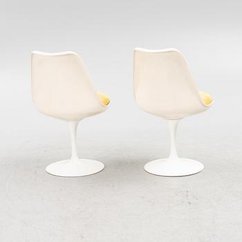 Eero Saarinen, a "Tulip" dining table with four chairs, 1970's.