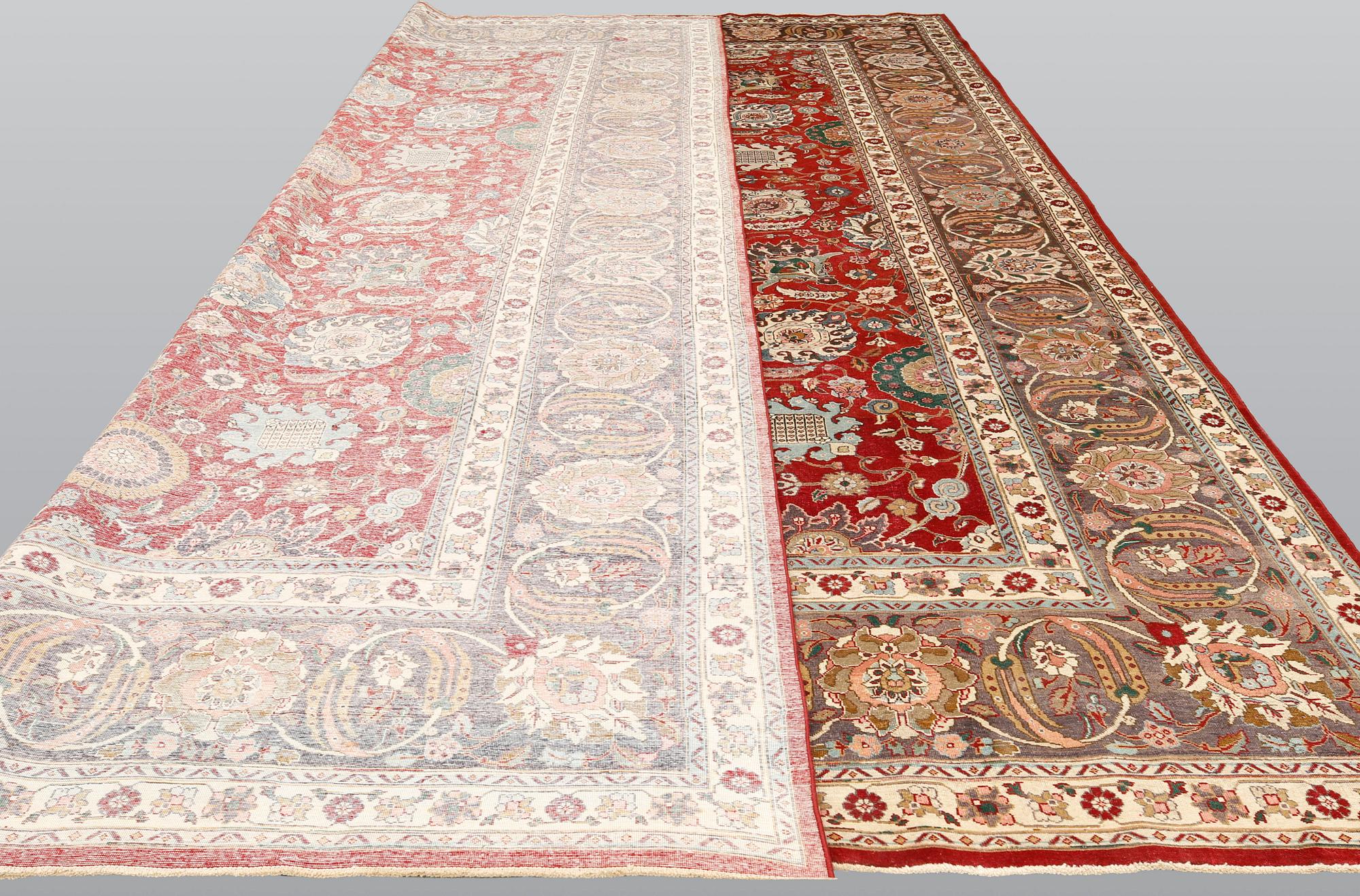A Tabriz carpet signed Amirkhiz, ca 485 x 343 cm.