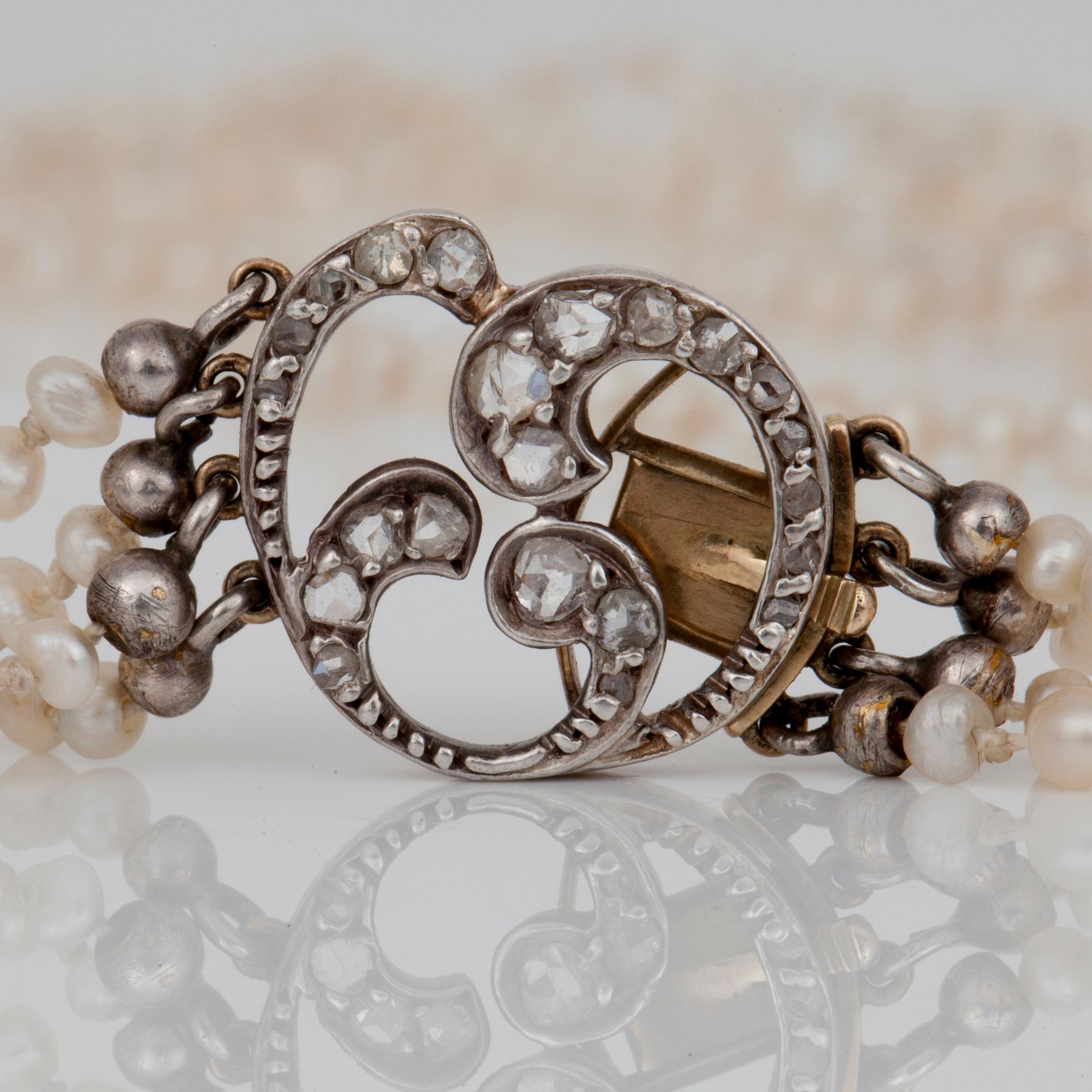 A 4-strand, probably natural saltwater pearl, necklace. Ø 2.4 - 2.6 mm.