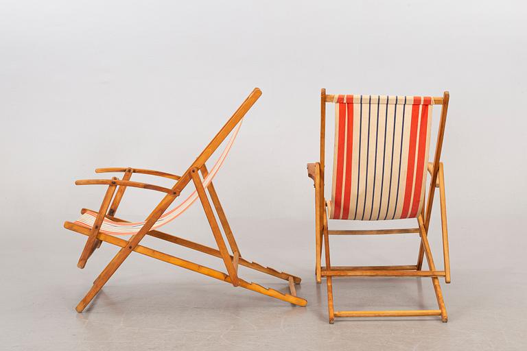 A pair of mid 20th century beach chairs.