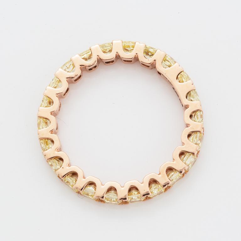 Cushion-cut yellow diamond eternity ring.